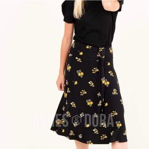 Agnes & Dora Side Sash Black Skirt with Yellow Floral Design